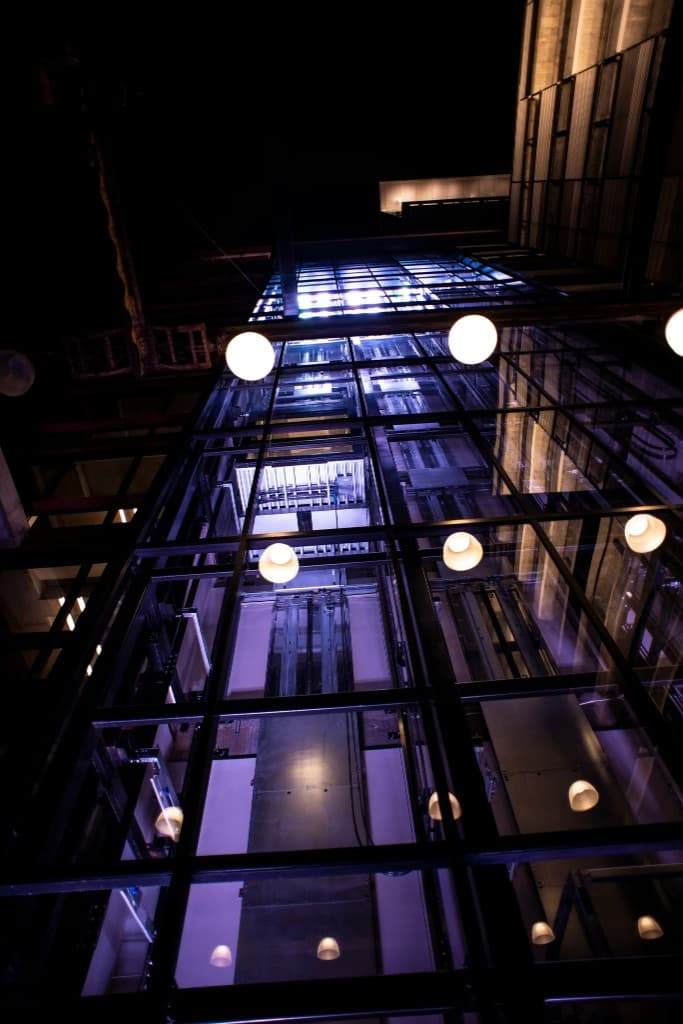 Glass elevator shaft lit at night