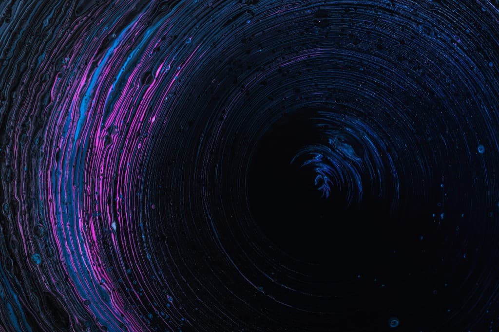 Abstract blue and magenta light swirl